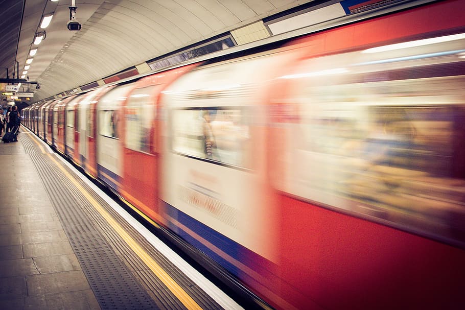timelapse photo of red and white train, underground, train station HD wallpaper