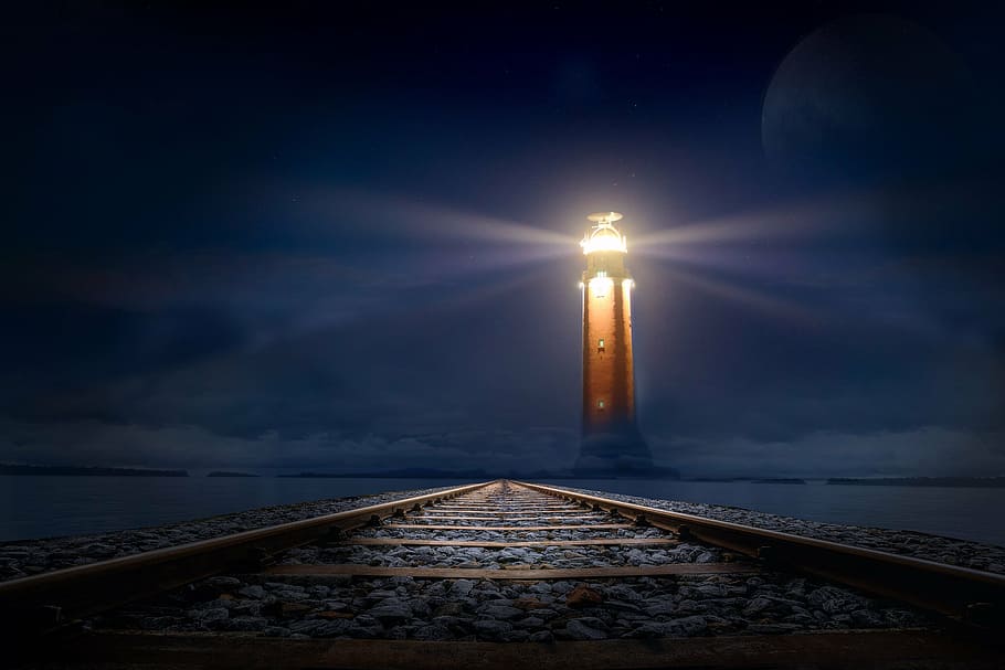 lighthouse during nighttime, glow, gleise, sea, photo montage HD wallpaper