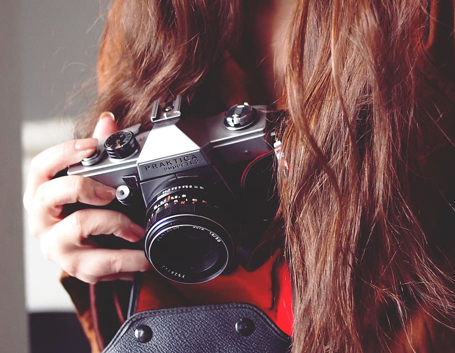 woman holding gray Praktica camera, photographing, tech, photography HD wallpaper