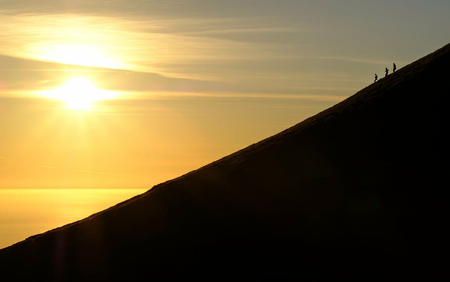 silhouette photo of three person on top of mountain, sunset HD wallpaper