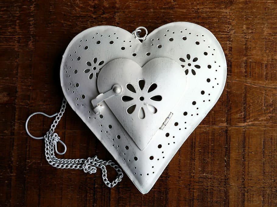 heart white laser cut leather bag on brown wooden surface, Container HD wallpaper