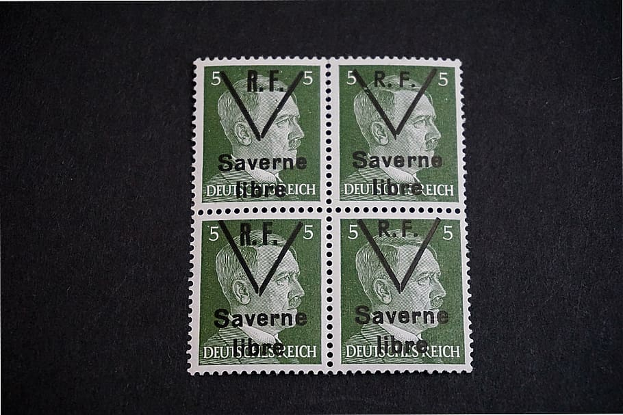 four 5 Saverne postage stamps on black surface, philately, historic character