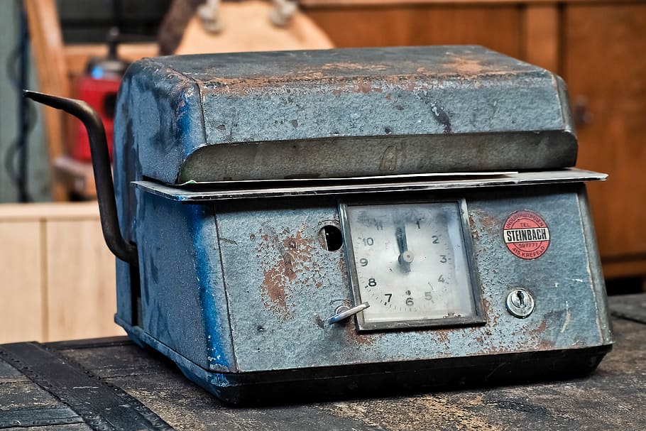 closed gray metal container on black tabletop, machine, clock HD wallpaper