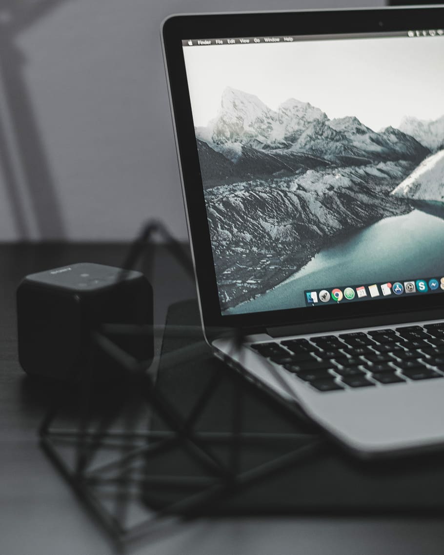 laptop computer with cube speaker, black and grey laptop computer turned on HD wallpaper