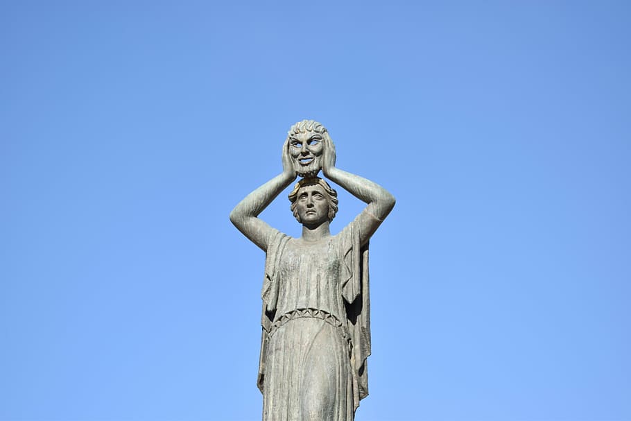 woman carrying mask statue, monument, spain, madrid, architecture