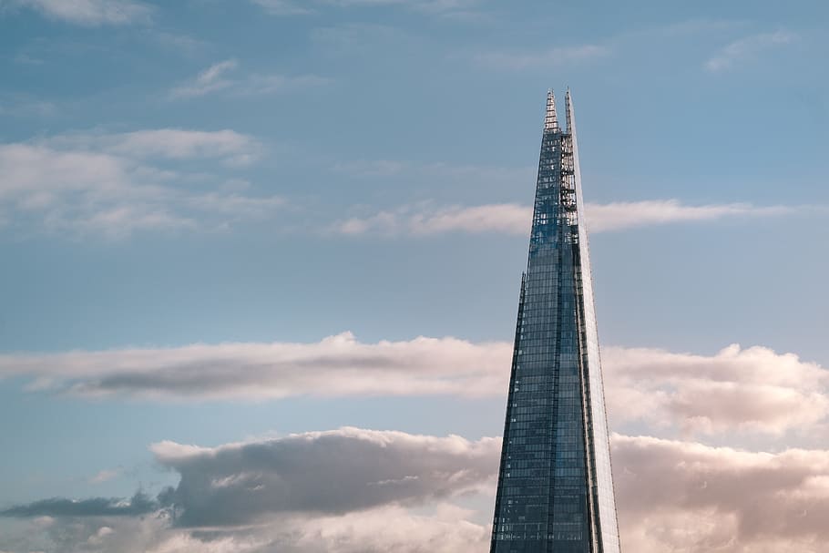 high-rise tower with white clouds in background, bird's-eye photography of high-rise building HD wallpaper
