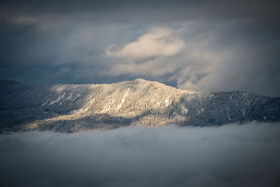 mountain view under cloudy sky during daytime, aerial view photography of mountain under cloudy sky HD wallpaper