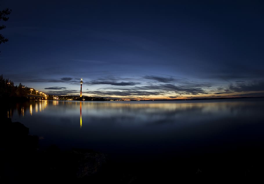 landscape photography of building, body of water view on cloudy sky HD wallpaper