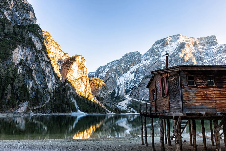 brown cabin beside lake, mountain during daytime, Braies, Italy HD wallpaper