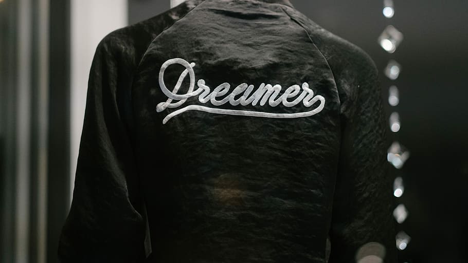 black Dreamer-printed jacket, person wearing black and white Dreamer top, HD wallpaper