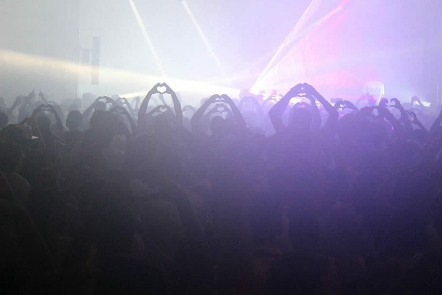 group of people inside the club with strobe lights, disco, party
