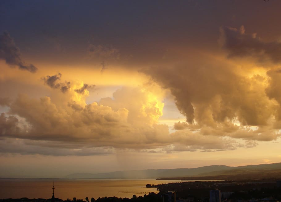 city near sea during golden hour, rain, clouds, sky, twilight, HD wallpaper