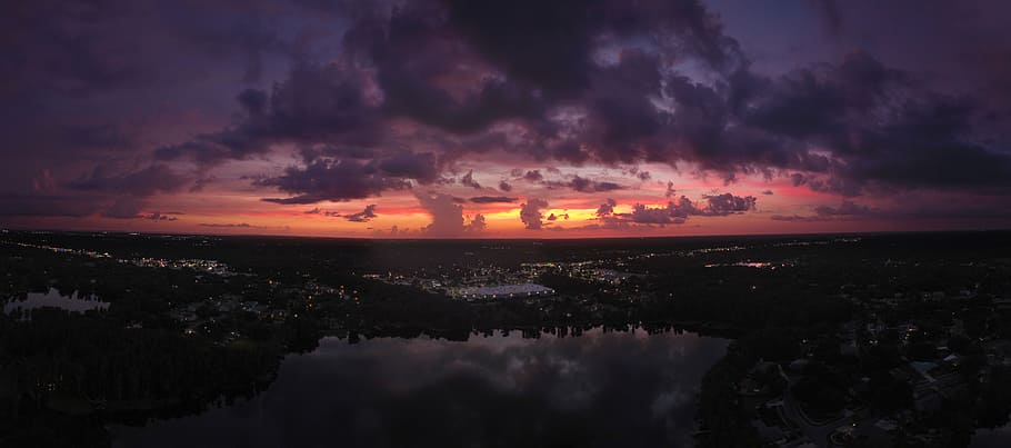scarlet skies near water, aerial view photography of trees during sunset HD wallpaper