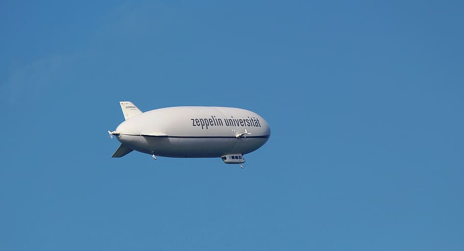 white Zeppellin Universible blimp, zeppelin, airship, aircraft