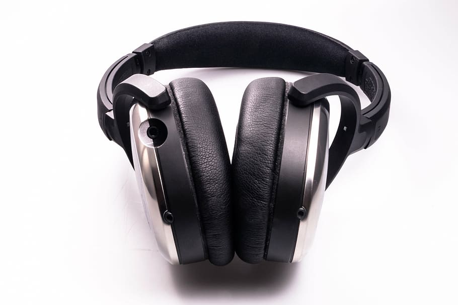 black and grey wireles headphones on white surface, earphones