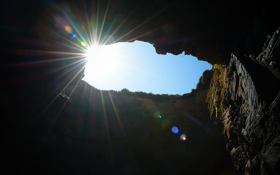 light entering inside cave at daytime, sun, radius, rock, look for