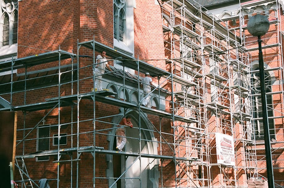 three men on top of scaffolding beside brick building, Craftsmen HD wallpaper