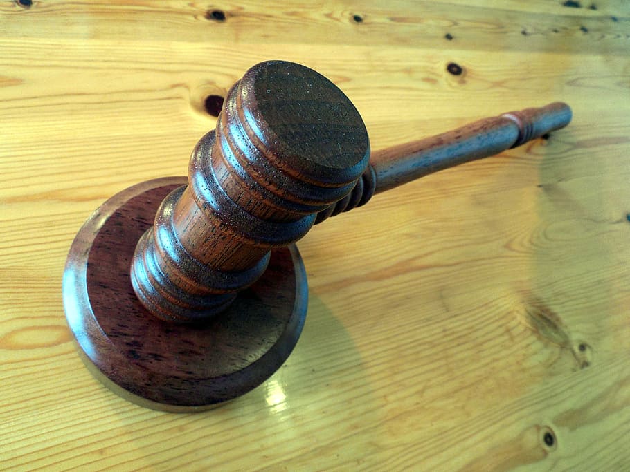 brown gavel on beige wood, court, hammer, auction, law, auctioneer