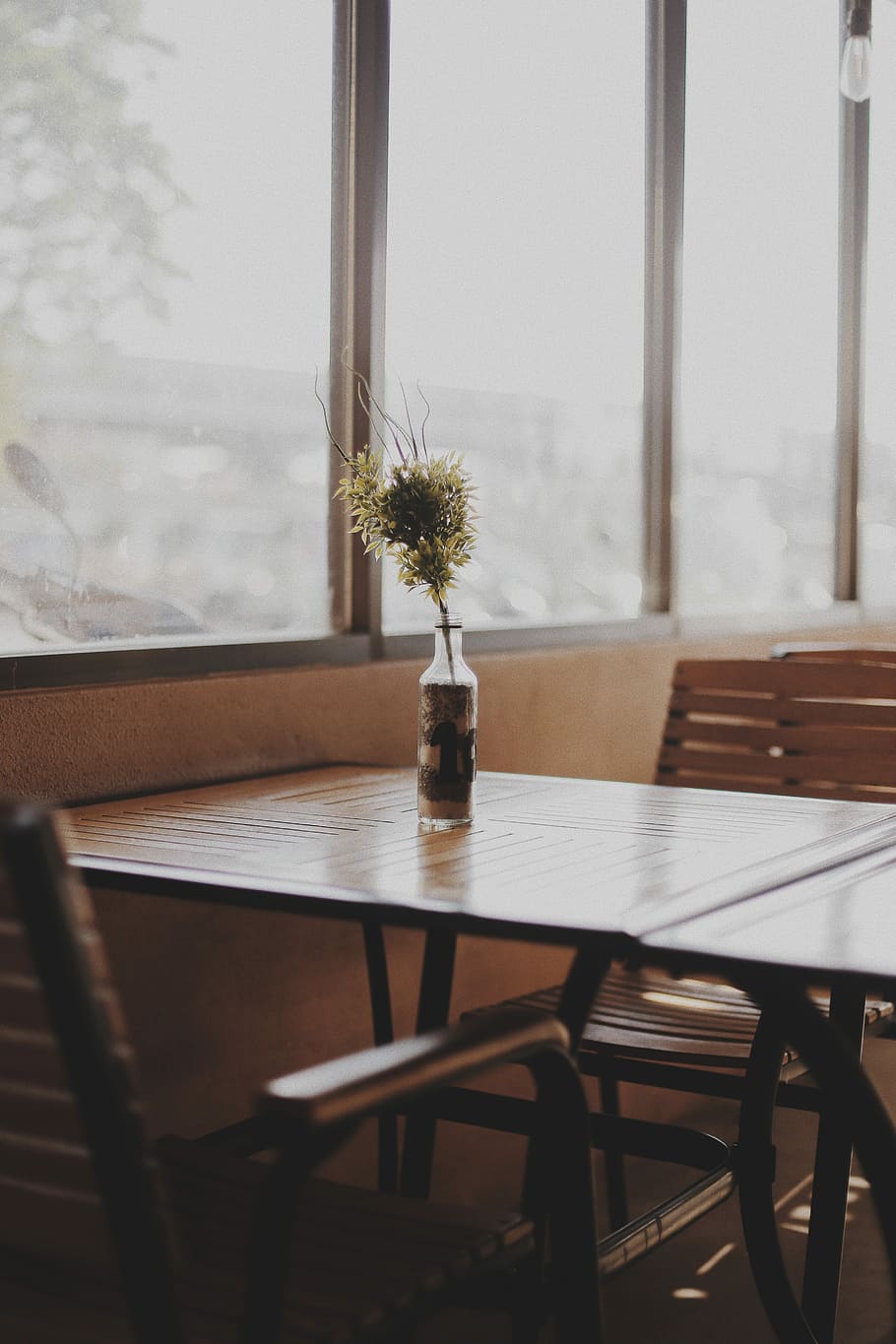 clear glass bottle top of table, yellow petaled flowers on vase HD wallpaper