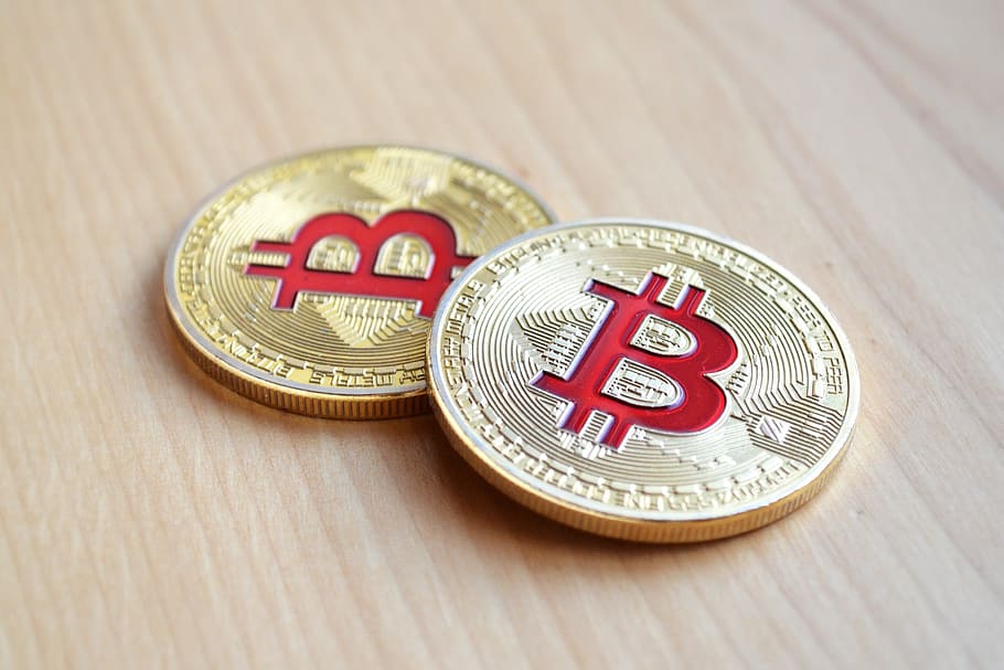 two Bitcoin coins on brown wooden surface, finance, currency, HD wallpaper