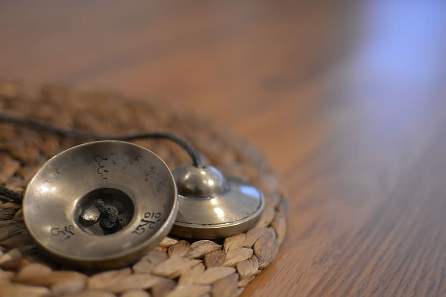 two round gray metal tools on brown wicker mat on table, Yoga HD wallpaper