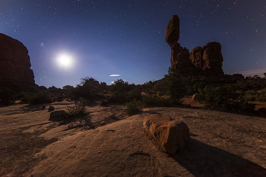 rock formation under starry skies, silhouette photo of rock formation HD wallpaper