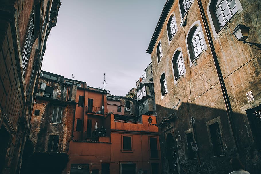 orange and black 3-storey building, low-angle photo of building HD wallpaper