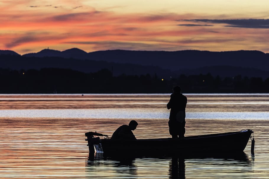 two person standing on boat on body of water during golden hour, silhouette of two person on jon boat under orange sky HD wallpaper