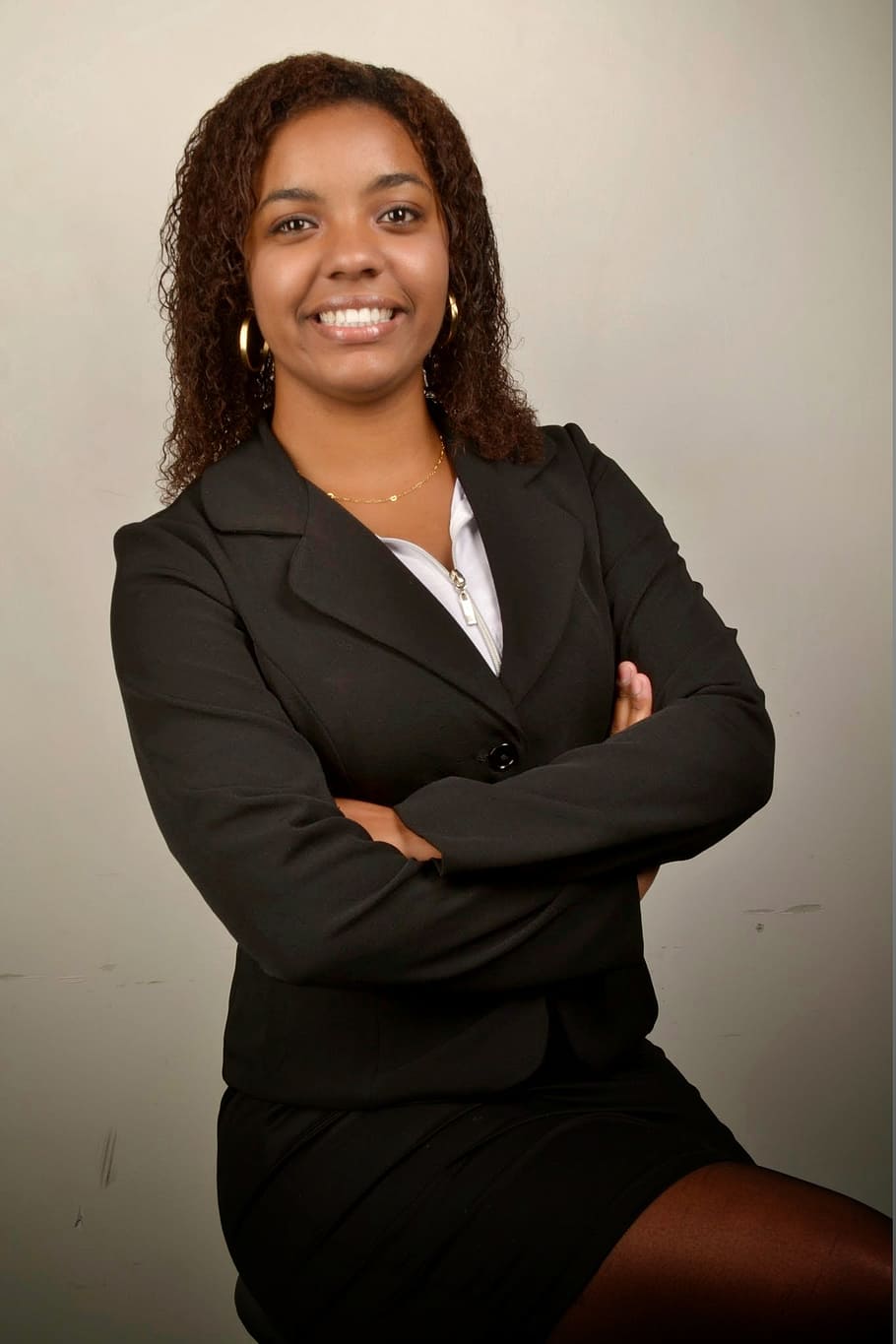 smiling woman wearing black suit, businesswoman, young, accounting