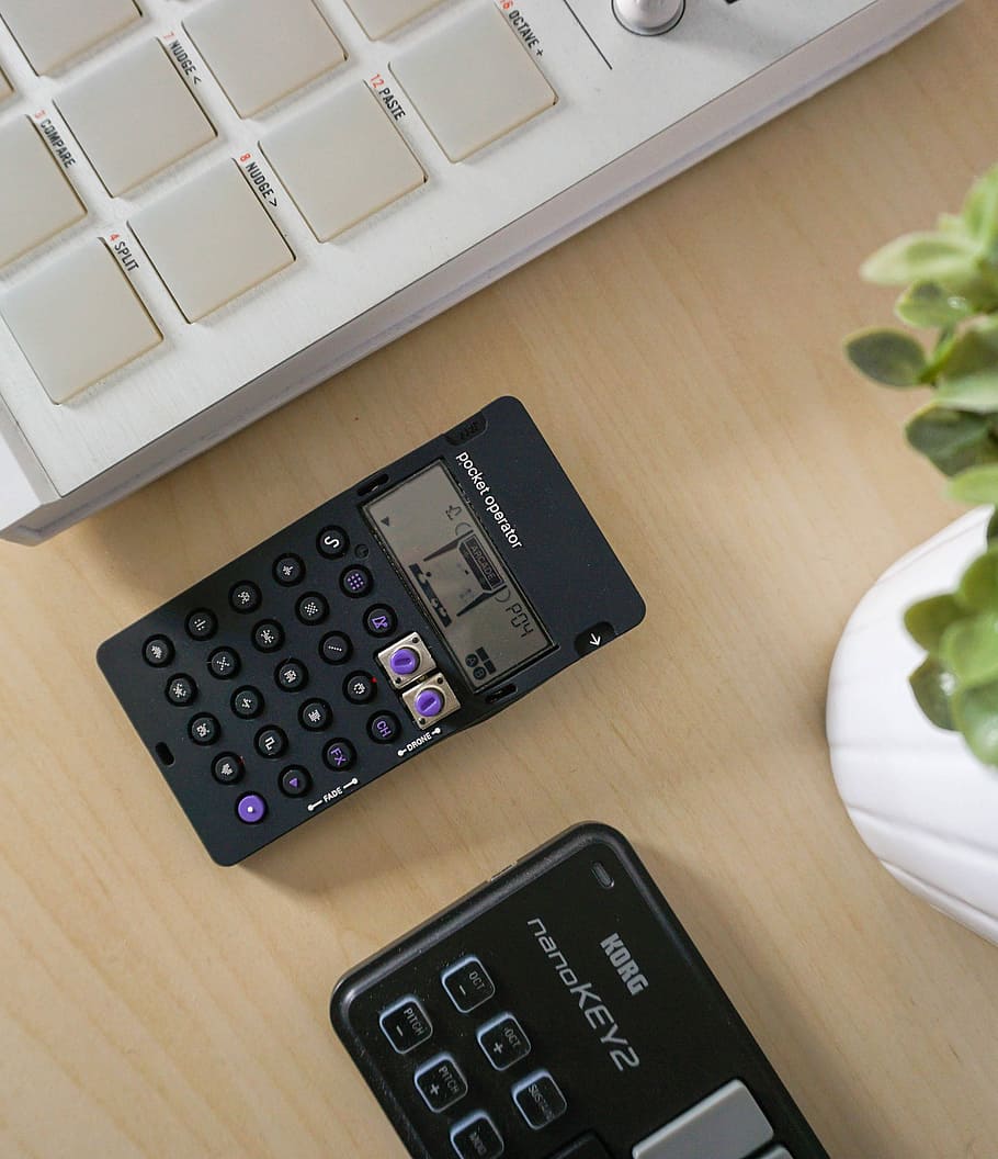 black digital device on table, black calculator near Korg Nanokey2 HD wallpaper