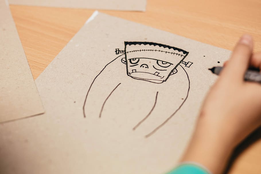 person drawing Frankenstein on brown board, Frankenstein illustration HD wallpaper