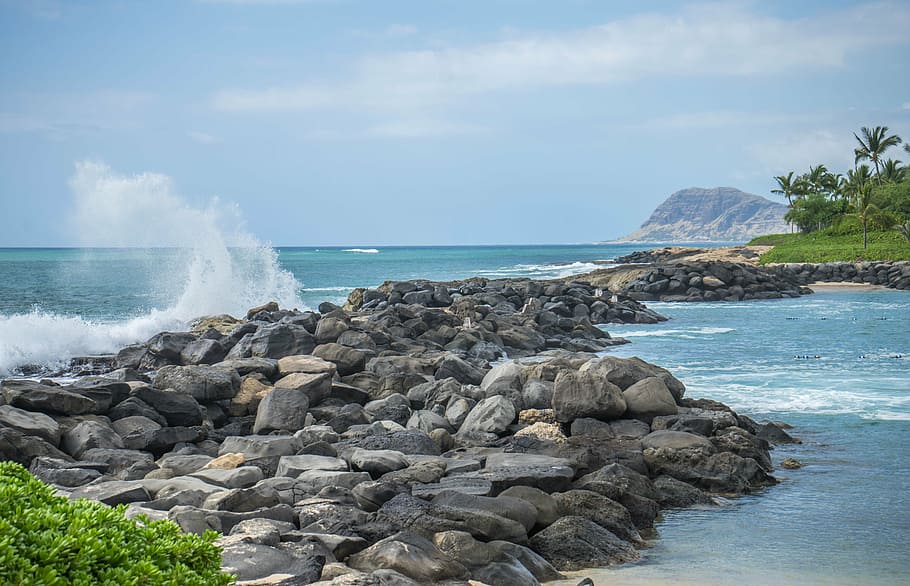 photo of rock formations near body of water, hawaii, oahu, waves