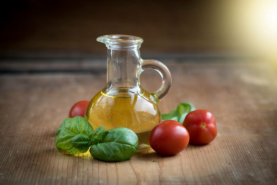 oil in vial near tomatoes, bottles, food, eat, glass bottles