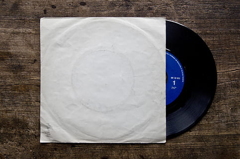 black and blue vinyl record on brown wooden top, gramophone record HD wallpaper