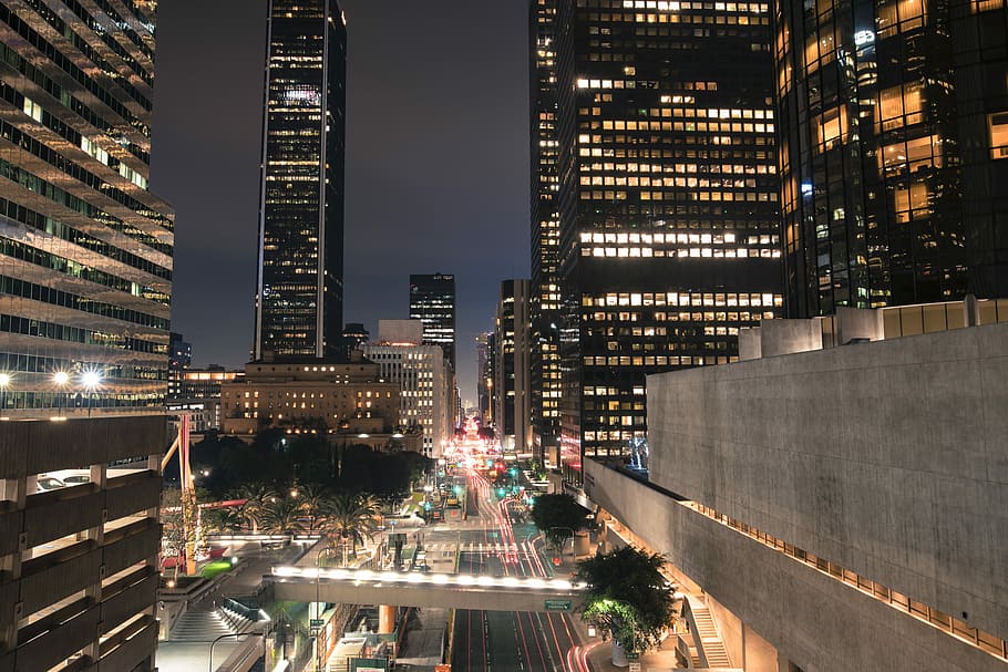 gray buildings during night time, city buildings during nighttime in time lapse photography HD wallpaper