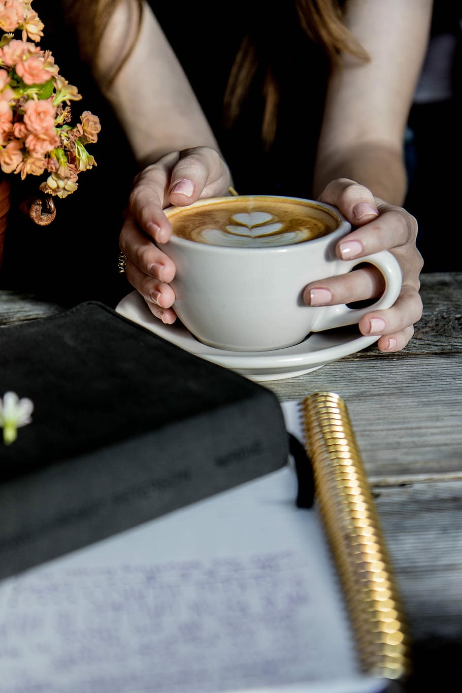 person holding beige ceramic mug filled by brown liquid, white ceramic teacup on saucer HD wallpaper