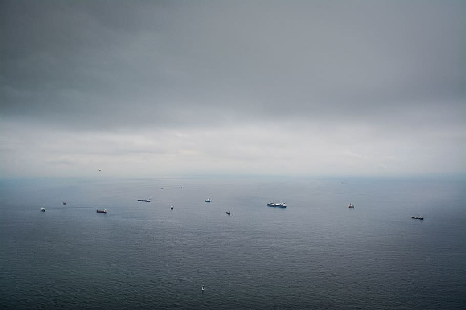 boats on calm sea under dim sky, boats on body of water, Cloudy HD wallpaper