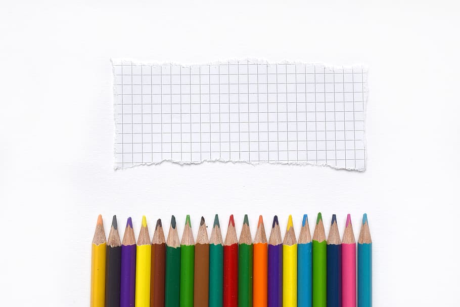 assorted-color color pencil lined up in front of ripped grid paper, HD wallpaper