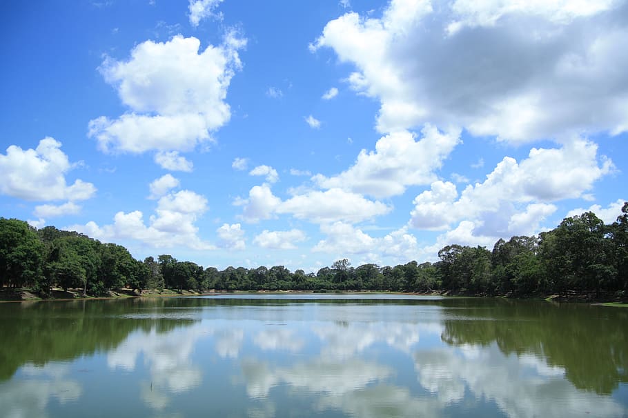 body of water between trees under clear blue sky, cambodia HD wallpaper