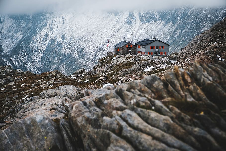 house on black mountain covered by snow, white and grey houses on top of icy mountains HD wallpaper