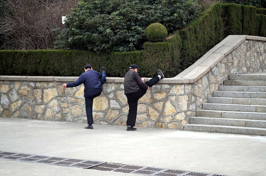 two men leaning their foot on wall near stairs, Stretch, Stretching HD wallpaper