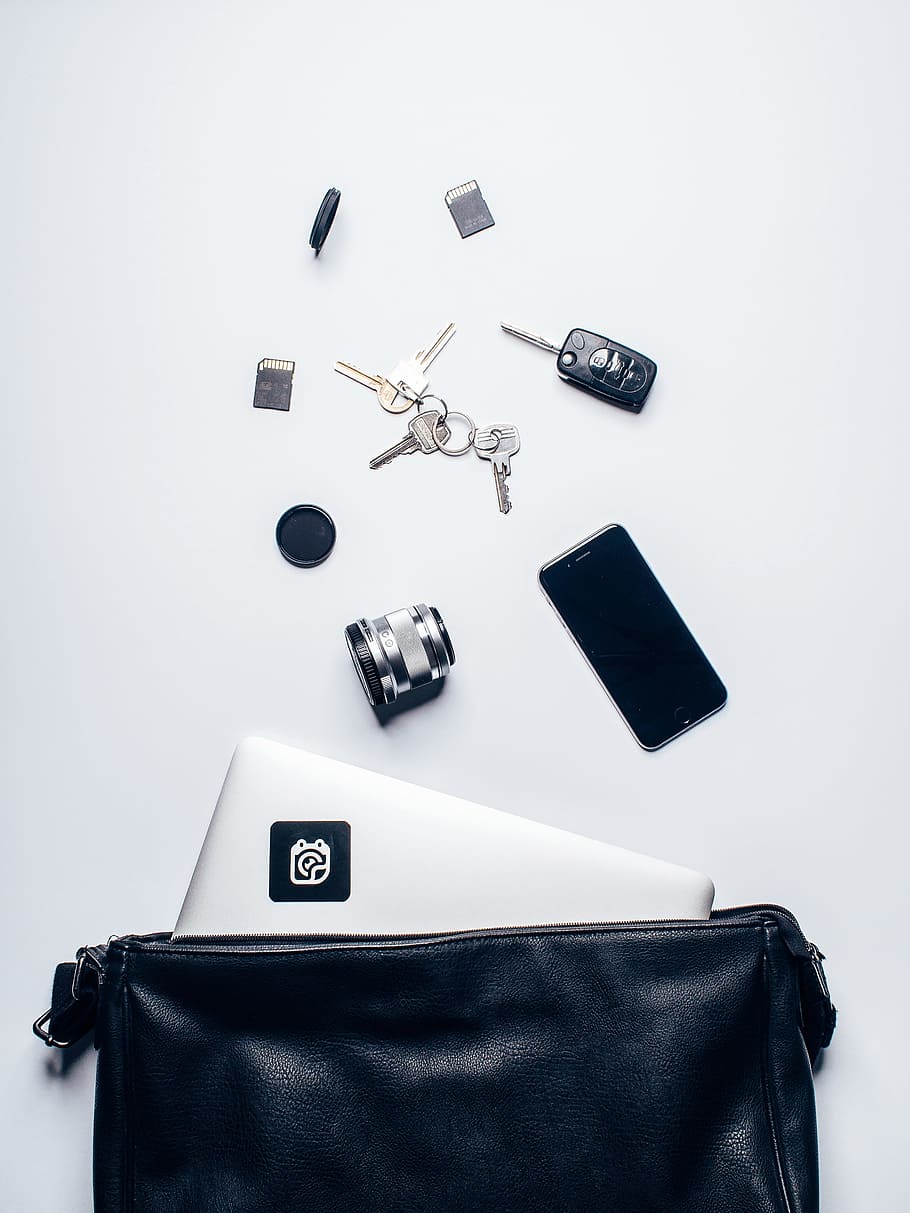 flat lay photography of devices and keys on white surface, leather HD wallpaper