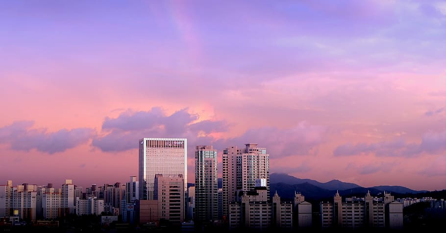high rise buildings on noon time, urban Skyline, sunset, cityscape