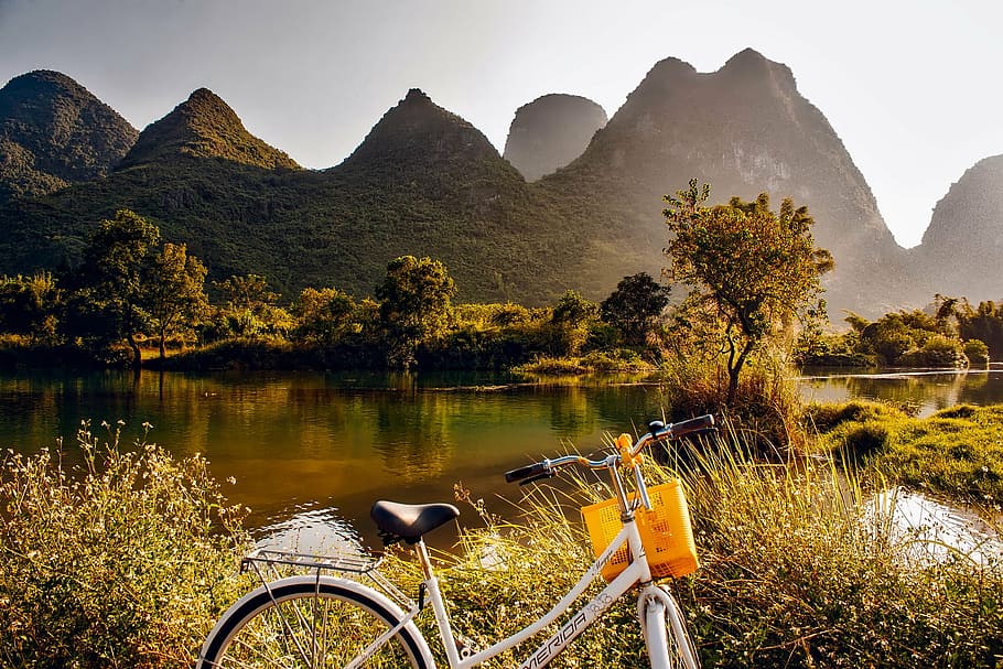 white cruiser bicycle photo during daytime, china, landscape