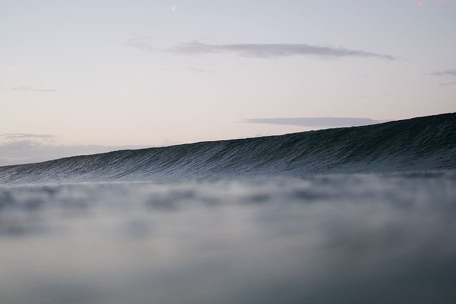 time lapsed photography of ocean wave under clear sky, desert under cumulus cloud HD wallpaper