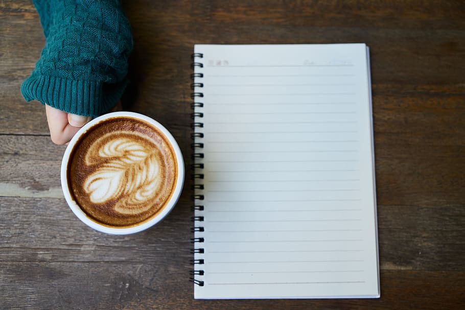 white and black ruled paper and ceramic mug filled with brown coffee HD wallpaper