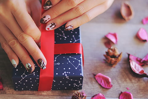 person holding blue constellations printed gift box, christmas HD wallpaper