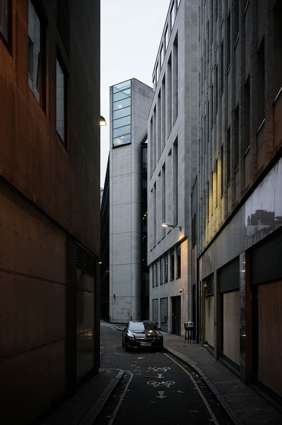 car travelling near buildings during daytime, vehicle travelling toward alley HD wallpaper