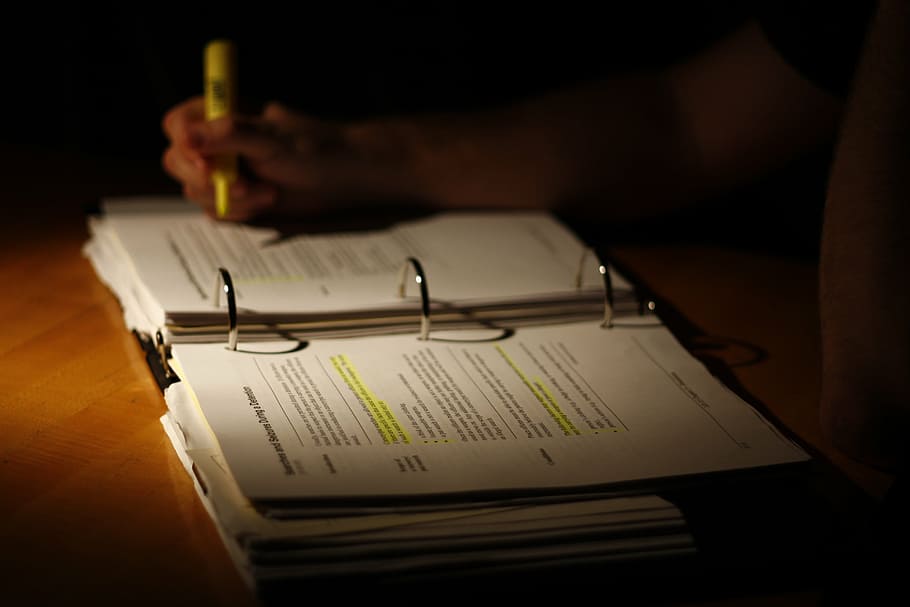 low-light photography of person highlighting book, learning HD wallpaper