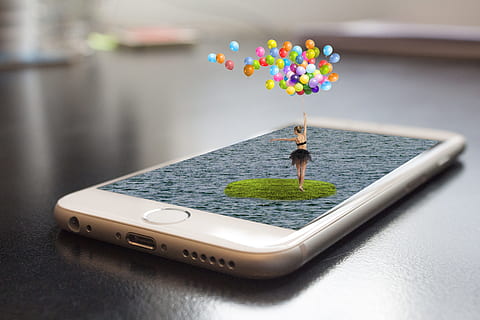 closeup photo of woman holding balloons on iPhone 6, Smartphone HD wallpaper